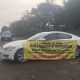 Mobil Sedan Jaguar Putih Tutup Akses Jalan Kawasan Industri Jaha